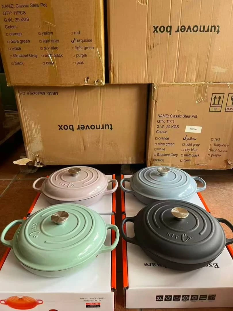 Enamelled cast iron stew pots in pink, blue, mint green and black